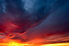 The dreary, drizzly afternoon had dashed my hopes for a photographic foray, so I instead spent the day cleaning my house and running various Christmas errands. While vaccuming my room, I suddenly noticed a brilliant orange-red stripe of light across my wall. Looking out the window I saw the clouds parting, making way for a gorgeous sunset. I grabbed my camera and tripod and ran to my truck to get to the top of the hill just in time to see the spectacular colors evolve in daylight's final gasp of life, making way for night.

Watching that sunset made me realize more than ever one of the reasons why I take photographs, to capure moments like this that would otherwise be lost forever. Things like sunrises and sunsets  last only a few precious moments, and if you dawdle, you will miss them. Just like life itself.