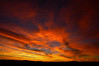The western sky is awash in yellows and oranges as the sun sets. It's always a battle between my urge to photograph these amazing things and my desire to simply invite someone whom I care about, and just watch together with them.